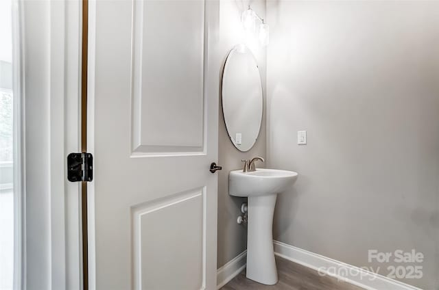 7517 Lancaster Hwy Unit 5, Waxhaw, NC 28173 - bathroom featuring baseboards, wood finished floors, and a sink