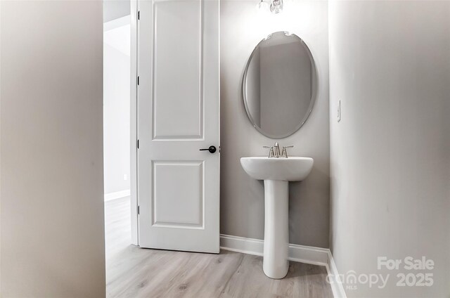7517 Lancaster Hwy Unit 5, Waxhaw, NC 28173 - bathroom with wood finished floors, baseboards, and a sink