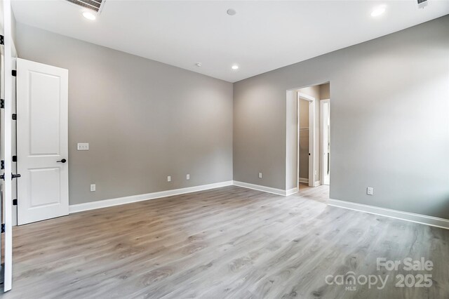 7517 Lancaster Hwy Unit 5, Waxhaw, NC 28173 - spare room with light wood-style flooring, baseboards, and recessed lighting