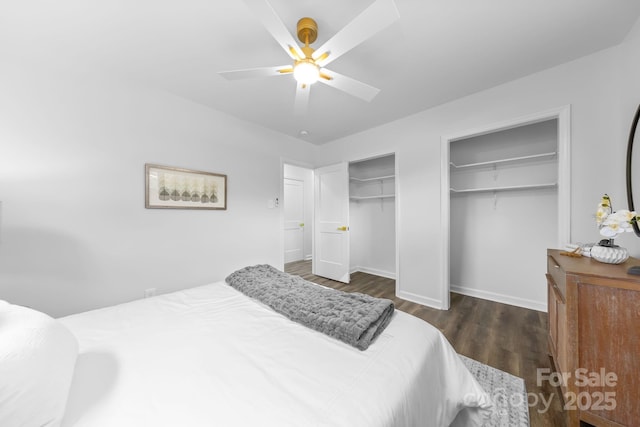 4226 Randolph Rd, Charlotte, NC 28211 - bedroom featuring two closets, wood finished floors, baseboards, and ceiling fan