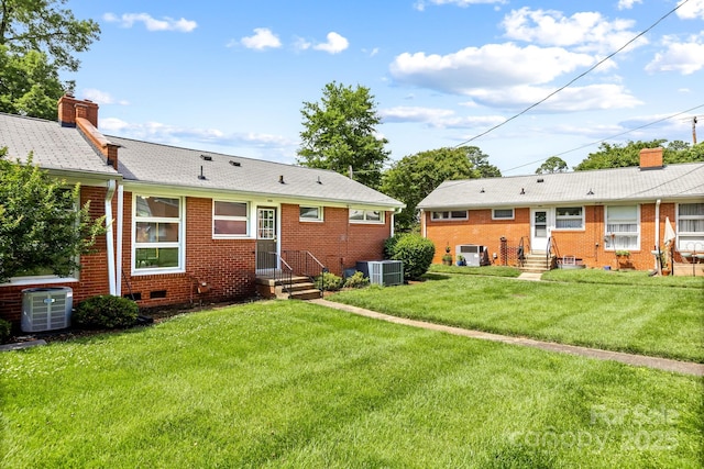 4226 Randolph Rd, Charlotte, NC 28211 - back of property with entry steps, central air condition unit, a chimney, brick siding, and a yard