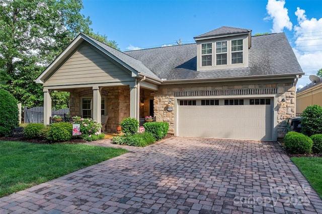 10502 Old Ardrey Kell Rd, Charlotte, NC 28277 - craftsman-style home with stone siding, driveway, a front lawn, roof with shingles, and a porch