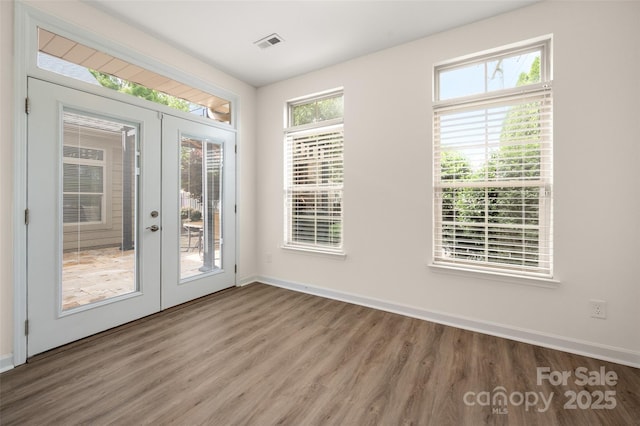 10502 Old Ardrey Kell Rd, Charlotte, NC 28277 - doorway to outside featuring french doors, wood finished floors, and baseboards