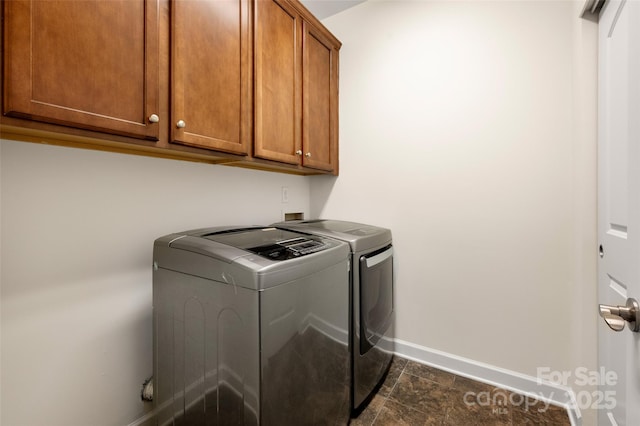 10502 Old Ardrey Kell Rd, Charlotte, NC 28277 - clothes washing area with cabinet space, washer and dryer, and baseboards