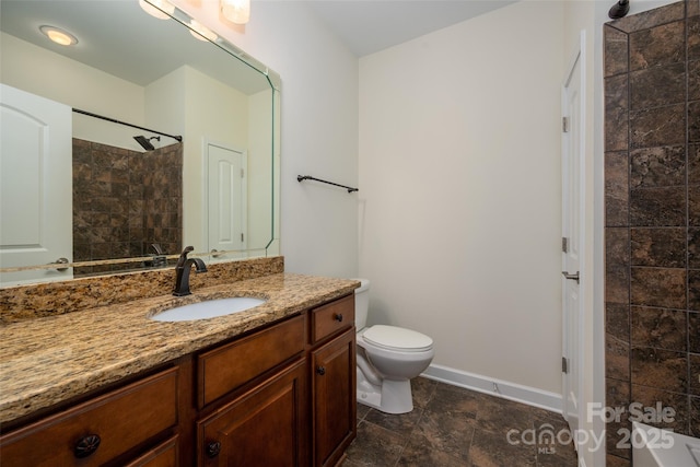 10502 Old Ardrey Kell Rd, Charlotte, NC 28277 - bathroom with vanity, a tile shower, toilet, and baseboards