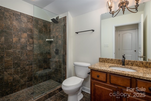10502 Old Ardrey Kell Rd, Charlotte, NC 28277 - full bath featuring a tile shower, toilet, a chandelier, and vanity