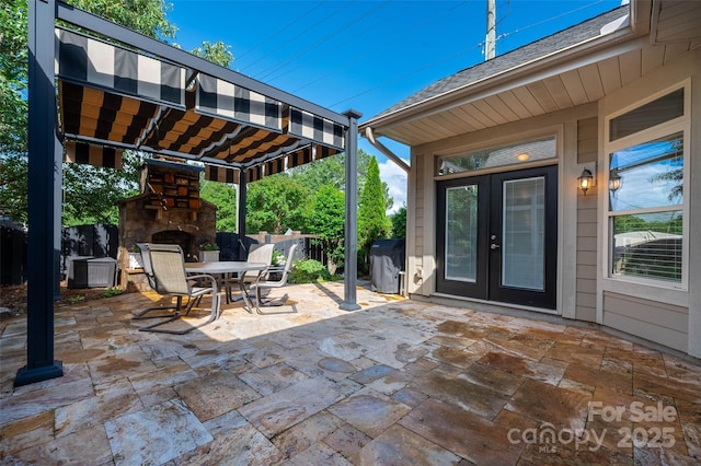 10502 Old Ardrey Kell Rd, Charlotte, NC 28277 - view of patio with a stone fireplace, french doors, outdoor dining area, and fence