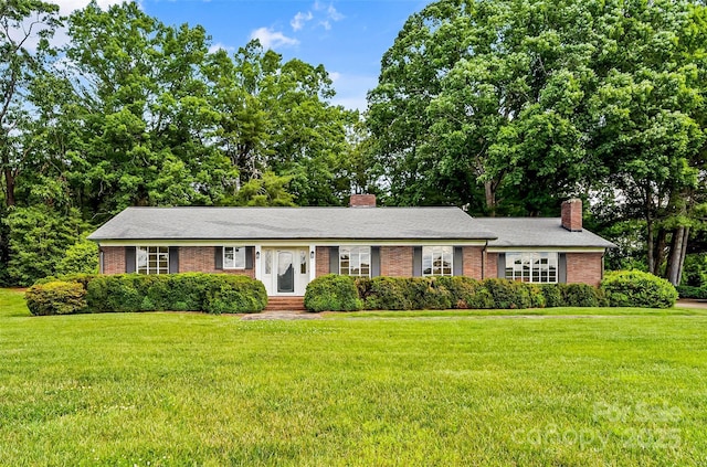 0 Pinewood Rd, Granite Falls, NC 28630 - single story home featuring a chimney, brick siding, a front yard, and entry steps
