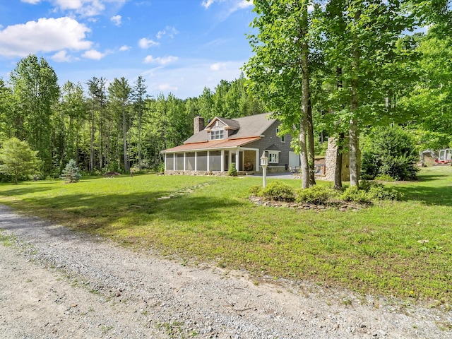 4290 Black Bear Trl, Morganton, NC 28655 - view of front of house with a sunroom, a chimney, and a front yard