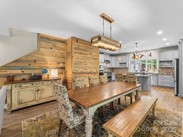 4290 Black Bear Trl, Morganton, NC 28655 - dining room with recessed lighting, light wood finished floors, and wood walls