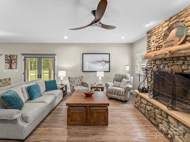4290 Black Bear Trl, Morganton, NC 28655 - living area featuring a ceiling fan, a stone fireplace, wood finished floors, and recessed lighting