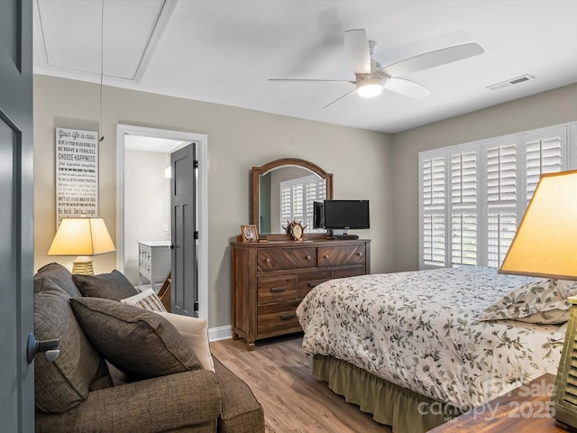 4290 Black Bear Trl, Morganton, NC 28655 - bedroom featuring attic access, light wood-style flooring, multiple windows, and a ceiling fan