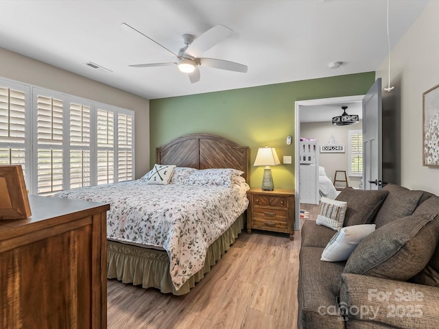 4290 Black Bear Trl, Morganton, NC 28655 - bedroom with multiple windows, light wood-type flooring, and ceiling fan