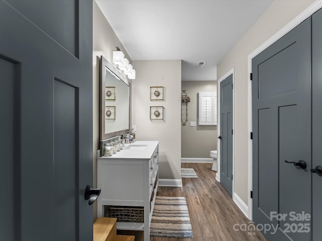 4290 Black Bear Trl, Morganton, NC 28655 - full bathroom featuring toilet, vanity, wood finished floors, and baseboards