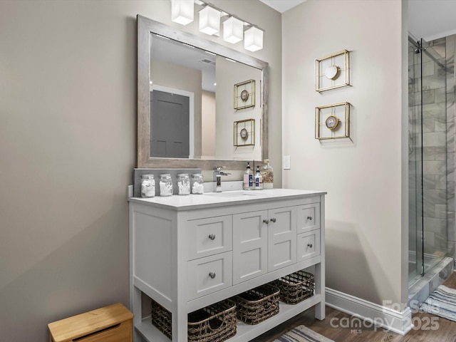 4290 Black Bear Trl, Morganton, NC 28655 - full bathroom featuring vanity, a shower stall, wood finished floors, and baseboards