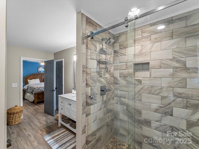 4290 Black Bear Trl, Morganton, NC 28655 - bathroom featuring a stall shower, vanity, ensuite bath, and wood finished floors