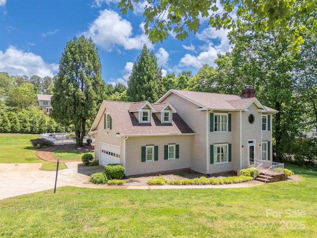 312 Briarwood Dr, Rutherfordton, NC 28139 - colonial inspired home featuring concrete driveway, a chimney, an attached garage, roof with shingles, and view of wooded area