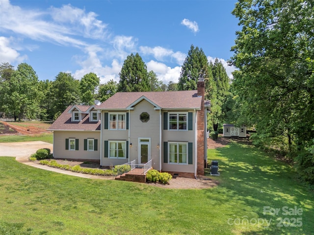 312 Briarwood Dr, Rutherfordton, NC 28139 - colonial home with a front yard and a chimney