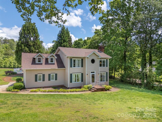 312 Briarwood Dr, Rutherfordton, NC 28139 - colonial house with a chimney and a front yard