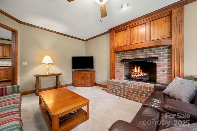 312 Briarwood Dr, Rutherfordton, NC 28139 - living room with light colored carpet, ceiling fan, ornamental molding, a brick fireplace, and baseboards