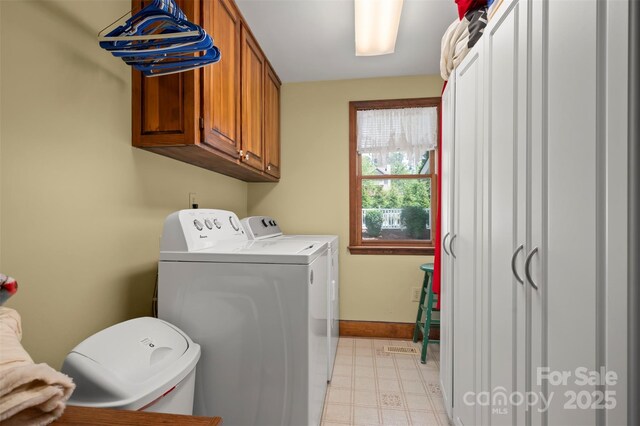 312 Briarwood Dr, Rutherfordton, NC 28139 - laundry room featuring independent washer and dryer, cabinet space, baseboards, and light floors