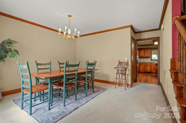 312 Briarwood Dr, Rutherfordton, NC 28139 - dining area with baseboards, a chandelier, crown molding, and light colored carpet