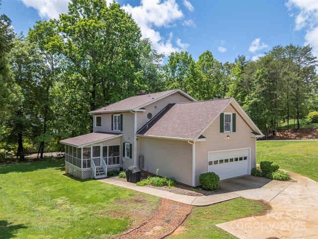 312 Briarwood Dr, Rutherfordton, NC 28139 - view of front of house featuring driveway, a sunroom, a shingled roof, a garage, and a front lawn
