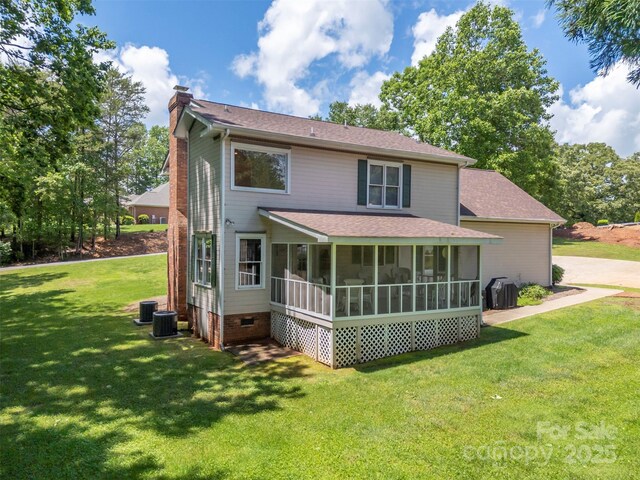 312 Briarwood Dr, Rutherfordton, NC 28139 - rear view of property featuring a chimney, a sunroom, a lawn, and roof with shingles