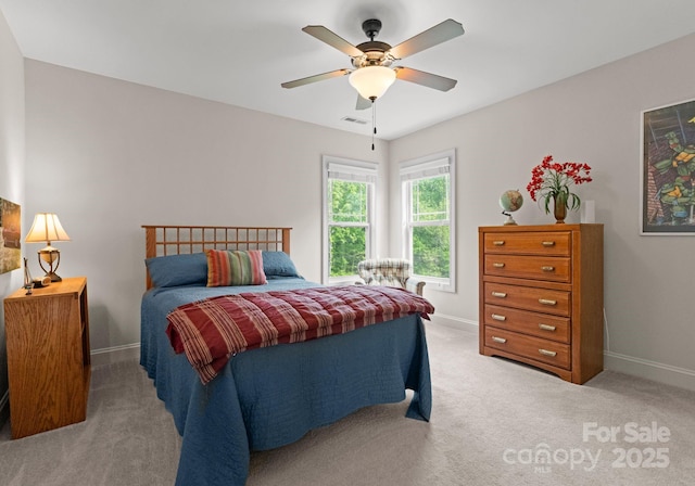 2606 Walker Rd, Matthews, NC 28105 - bedroom with baseboards, light carpet, and ceiling fan