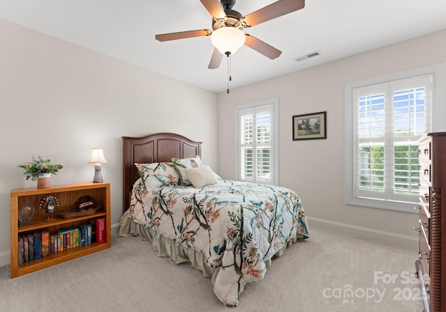 2606 Walker Rd, Matthews, NC 28105 - bedroom with light carpet, baseboards, and ceiling fan
