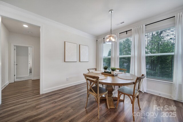 13222 Fiore Pl, Huntersville, NC 28078 - dining space with dark wood finished floors, baseboards, and ornamental molding