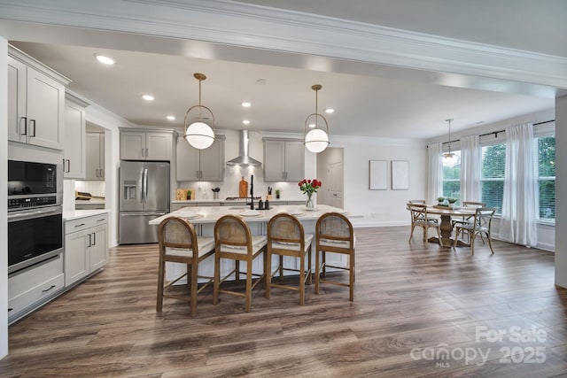 13222 Fiore Pl, Huntersville, NC 28078 - kitchen with appliances with stainless steel finishes, wall chimney exhaust hood, ornamental molding, light countertops, and decorative backsplash