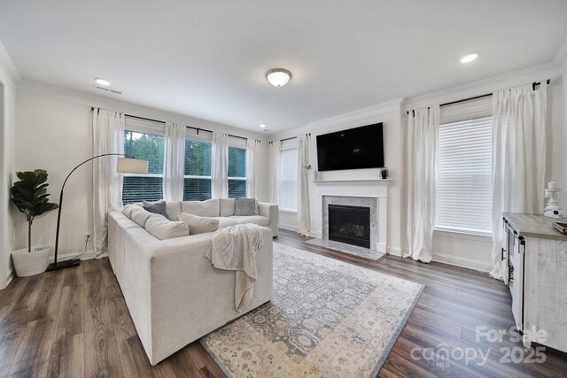 13222 Fiore Pl, Huntersville, NC 28078 - living room with crown molding, a fireplace with flush hearth, dark wood-style flooring, baseboards, and recessed lighting