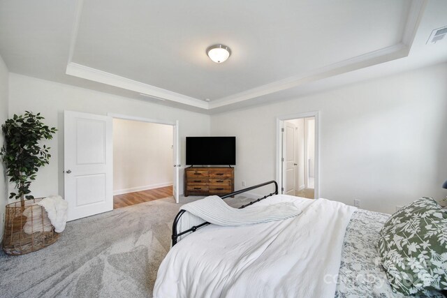 13222 Fiore Pl, Huntersville, NC 28078 - carpeted bedroom with a tray ceiling and ornamental molding