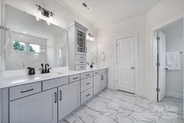 13222 Fiore Pl, Huntersville, NC 28078 - full bathroom with a shower stall, marble finish floors, baseboards, and double vanity