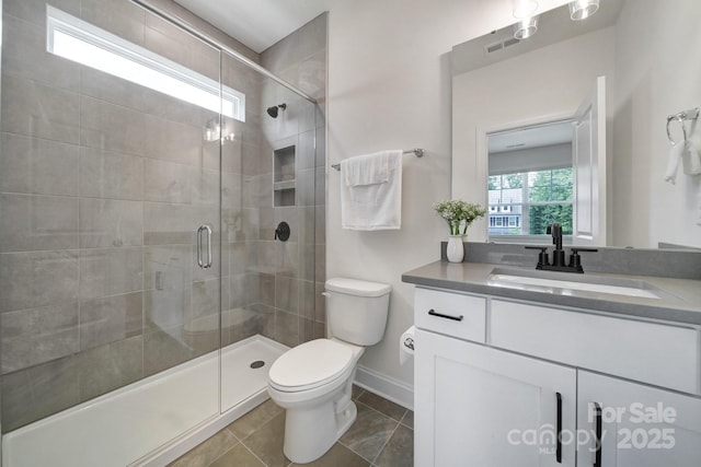 13222 Fiore Pl, Huntersville, NC 28078 - full bathroom featuring a shower stall, toilet, vanity, and baseboards