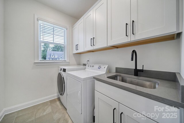 13222 Fiore Pl, Huntersville, NC 28078 - clothes washing area with cabinet space, washing machine and clothes dryer, and baseboards