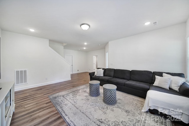 13222 Fiore Pl, Huntersville, NC 28078 - living area featuring wood finished floors, stairs, baseboards, and recessed lighting
