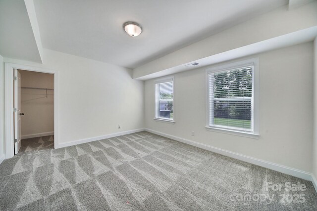 13222 Fiore Pl, Huntersville, NC 28078 - unfurnished bedroom featuring baseboards, light carpet, and a spacious closet
