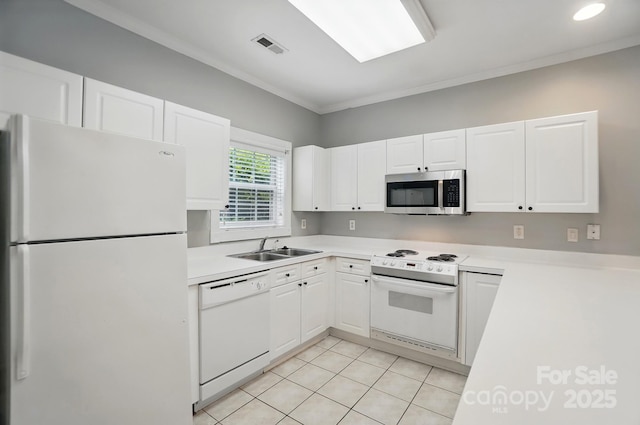 8731 Coralbell Ln, Charlotte, NC 28213 - kitchen with white appliances, a sink, white cabinetry, and crown molding