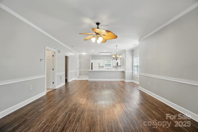 8731 Coralbell Ln, Charlotte, NC 28213 - unfurnished living room featuring a chandelier, a ceiling fan, dark wood-style floors, crown molding, and baseboards