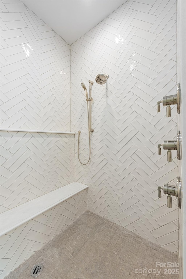 bathroom with a tile shower