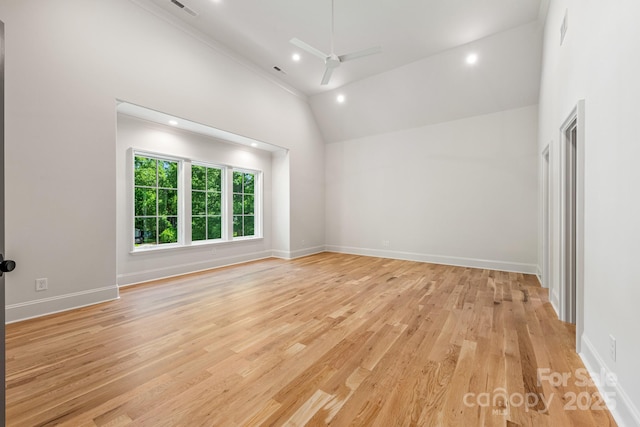 empty room featuring ceiling fan, light wood-style floors, high vaulted ceiling, recessed lighting, and baseboards