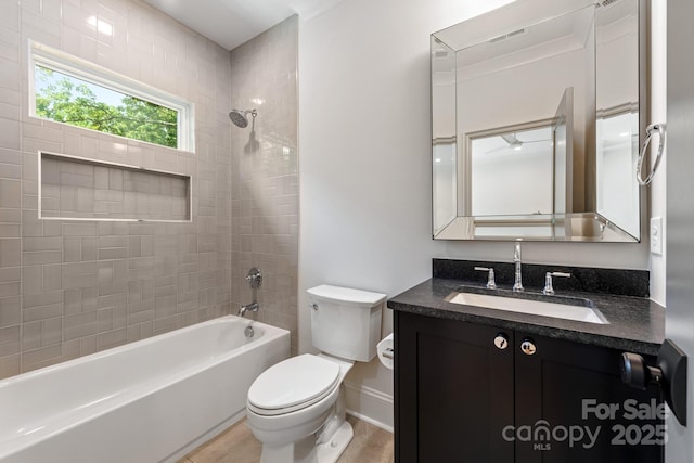 bathroom with toilet, bathtub / shower combination, vanity, baseboards, and tile patterned flooring