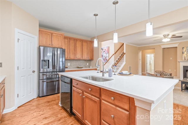 14104 Kendrick Cross Rd, Charlotte, NC 28273 - kitchen featuring stainless steel fridge, a sink, dishwasher, light wood finished floors, and light countertops