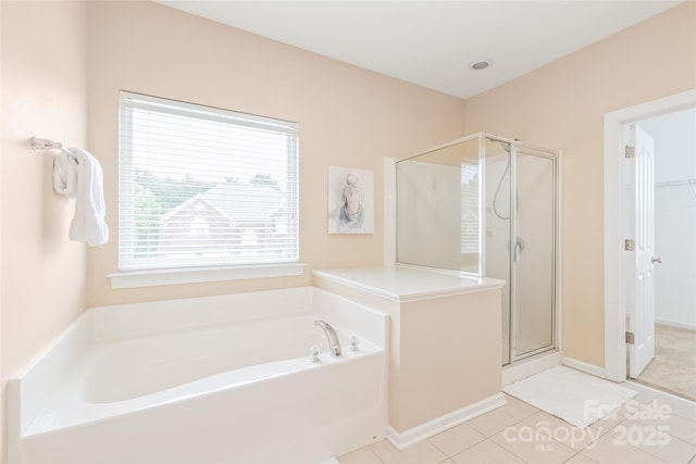 14104 Kendrick Cross Rd, Charlotte, NC 28273 - full bath featuring a stall shower, a garden tub, tile patterned flooring, and baseboards