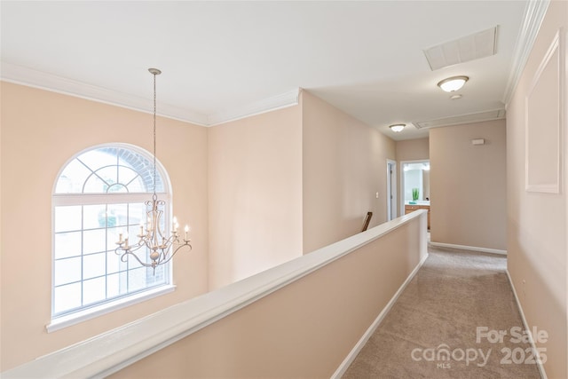 14104 Kendrick Cross Rd, Charlotte, NC 28273 - hall with light carpet, an upstairs landing, attic access, baseboards, and a chandelier