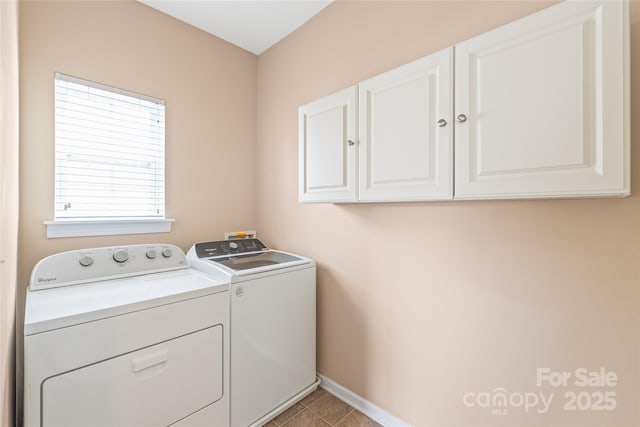 14104 Kendrick Cross Rd, Charlotte, NC 28273 - laundry area featuring cabinet space, independent washer and dryer, baseboards, and light tile patterned floors