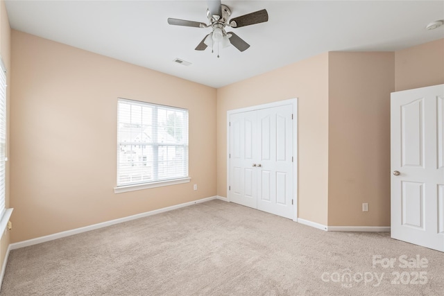 14104 Kendrick Cross Rd, Charlotte, NC 28273 - unfurnished bedroom with carpet flooring, baseboards, a closet, and a ceiling fan