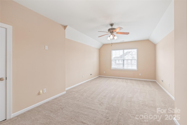 14104 Kendrick Cross Rd, Charlotte, NC 28273 - carpeted spare room featuring lofted ceiling, baseboards, and ceiling fan
